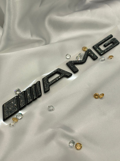 Original OEM | Mercedes-Benz AMG Logo Emblem | mit original Preciosa® Kristallen - Black Saphir Crystals