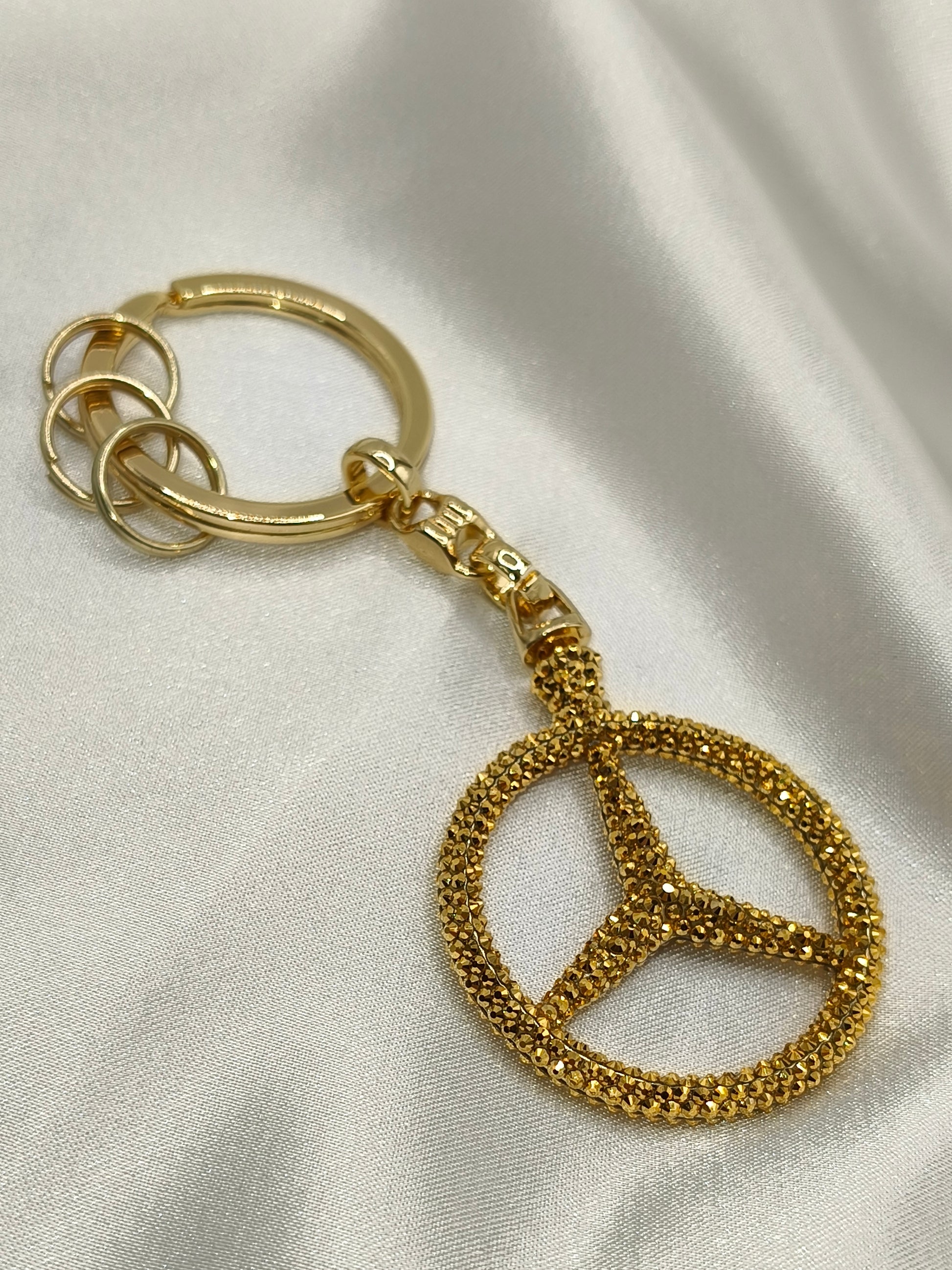 Original OEM | Mercedes-Benz Schlüsselanhänger Gold | mit original Preciosa® Kristallen - Black Saphir Crystals