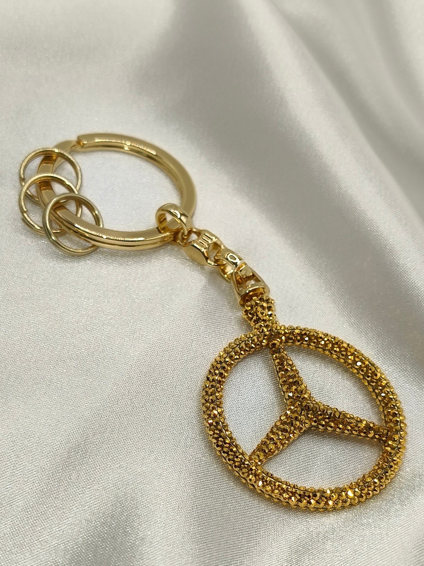 Original OEM | Mercedes-Benz Schlüsselanhänger Gold | mit original Preciosa® Kristallen - Black Saphir Crystals